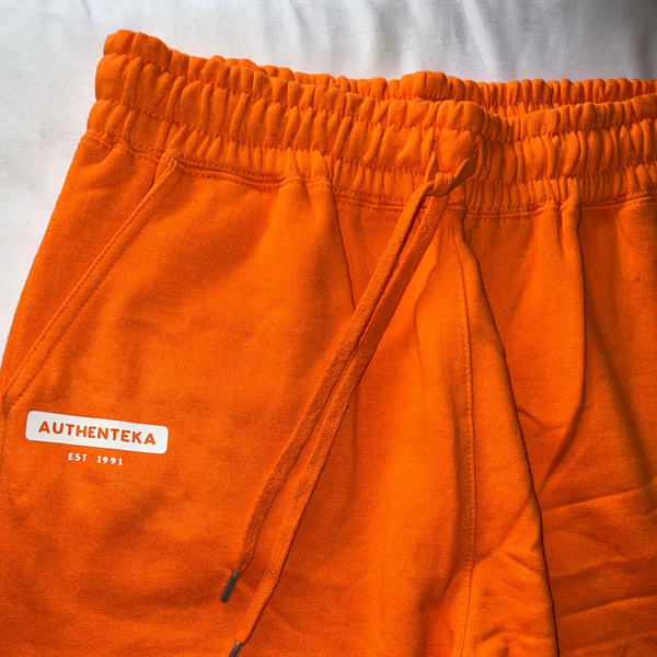 AUTHENTEKA UNISEX SHORTS- orange x white